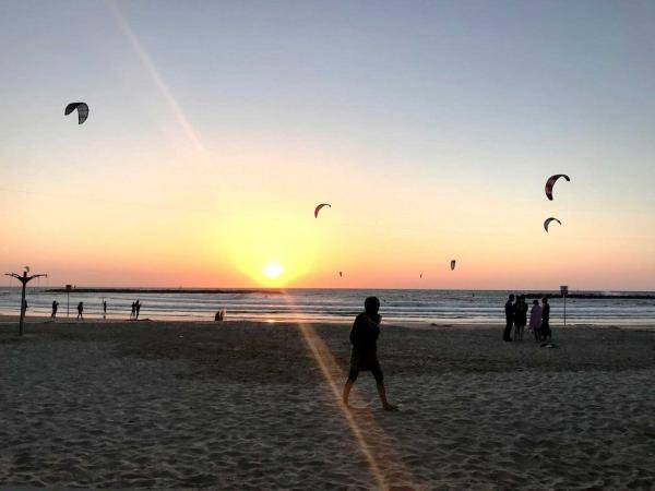 Windsurfers on Shabbat. Saturdays are the busiest time for Israel&rsquo;s beaches; people of all ages come to enjoy the day off.  