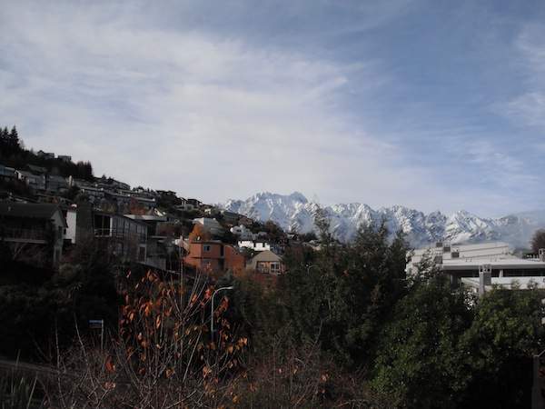 The view from Taylor's back balcony, facing the snow-covered&nbsp;Remarkables mountain range.
